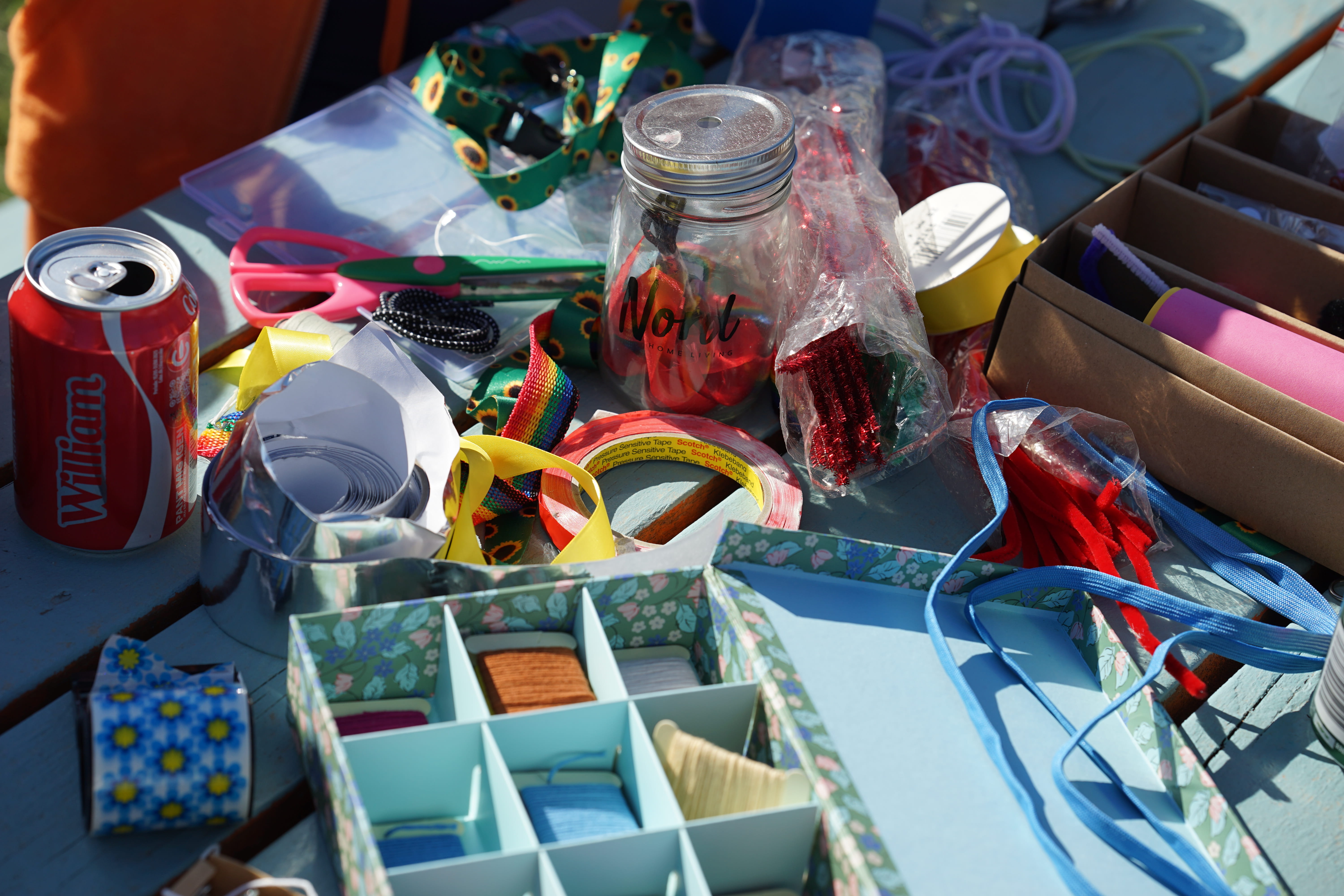 Participants working on sunflower lanyards